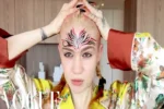 Grimes Unveils Large Face Tattoo